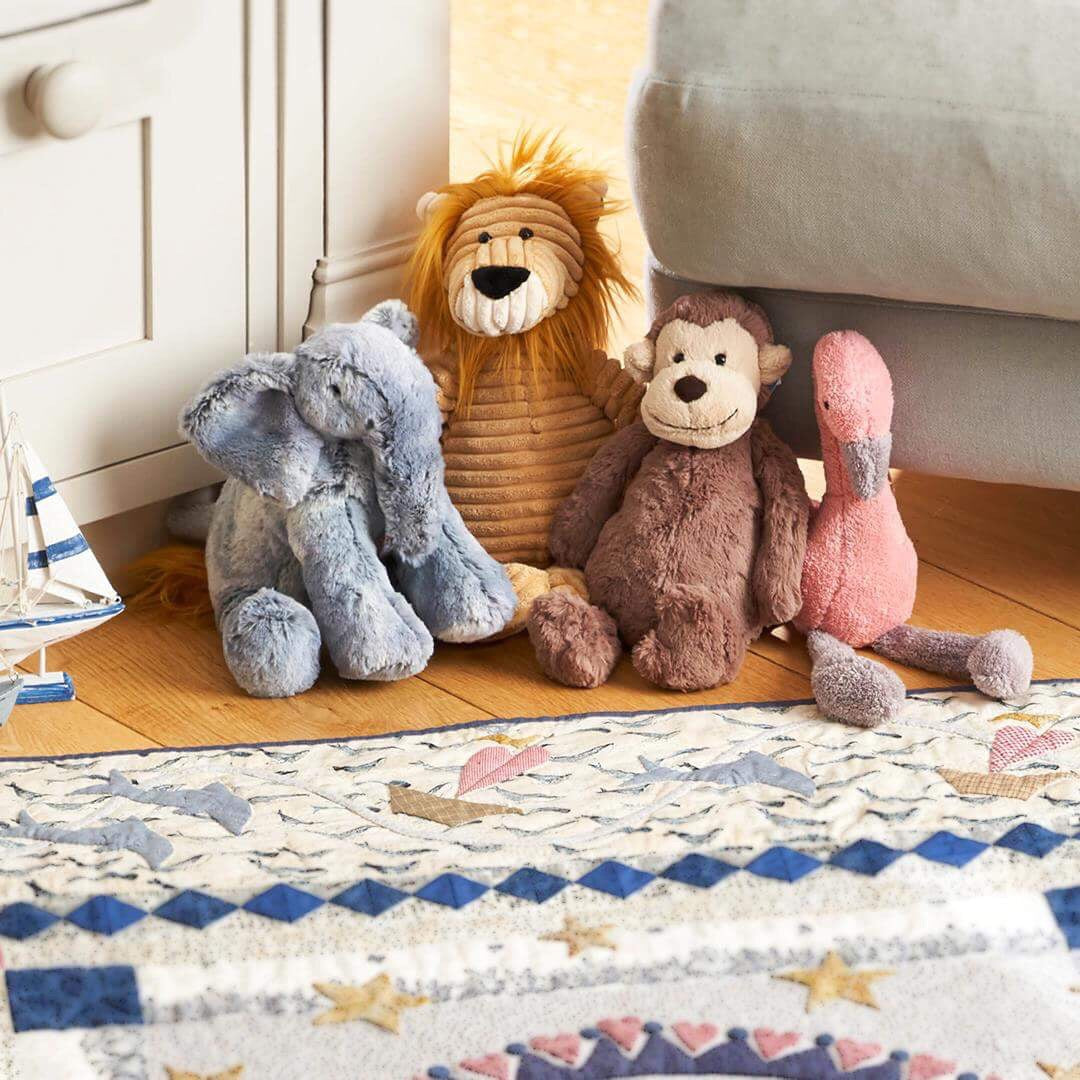 Stuffed Animals by Jellycat including a Jellycat Elephant, Jellycat Lion, Jellycat Monkey, Jellycat Flamingo