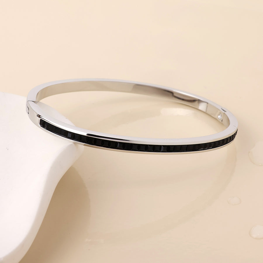 POM - Elera stainless steel platinum plated black crystal inset fine bangle