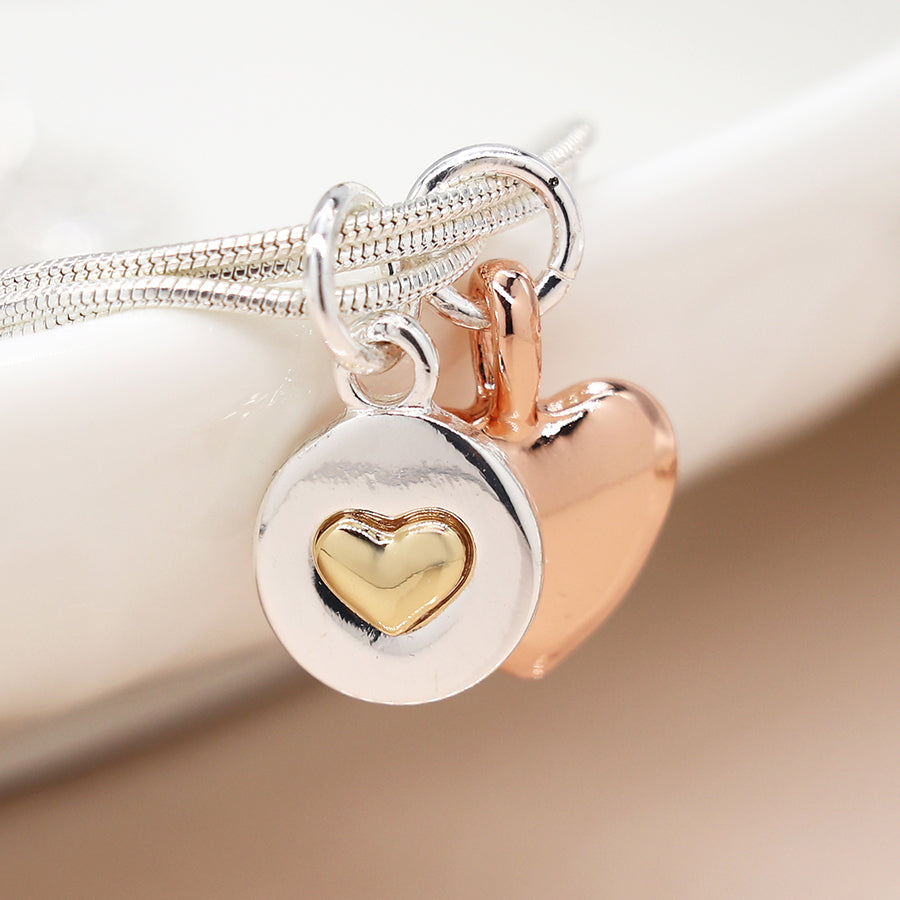 Silver plated and rose gold double heart charm bracelet