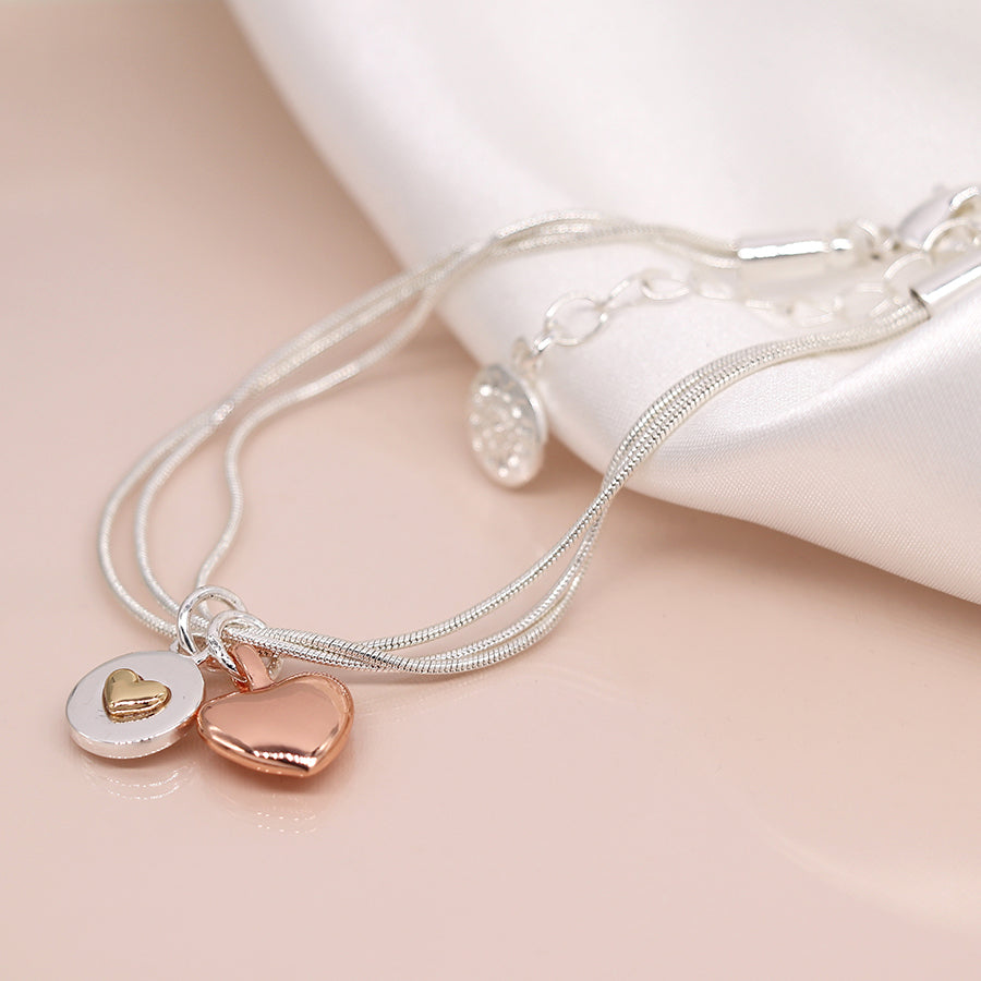 Silver plated and rose gold double heart charm bracelet
