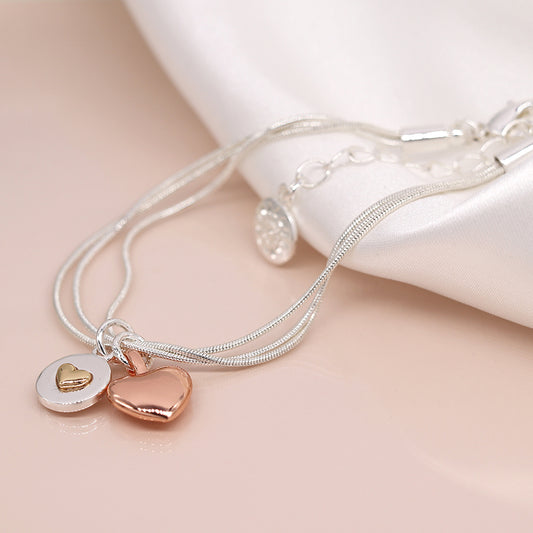 Silver plated and rose gold double heart charm bracelet