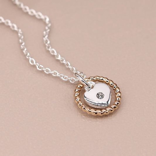 Silver plated necklace with heart and golden twist hoop