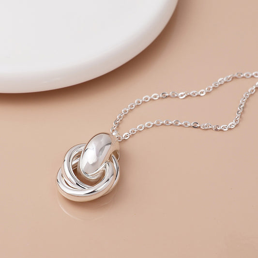 Silver plated polished knot necklace