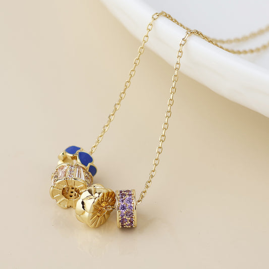 Golden mixed crystal and blue rings necklace