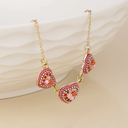 POM - Clara faux gold plated beaded pink triple heart necklace