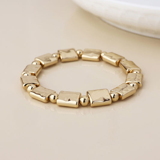 POM - Cassia golden polished bead and oblong stretch bracelet